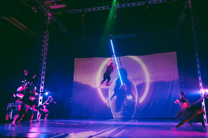 Reality Collapse stage with aerial pole, projection and dancers